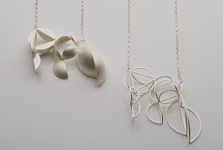 A pair of necklaces by Jo Hawley