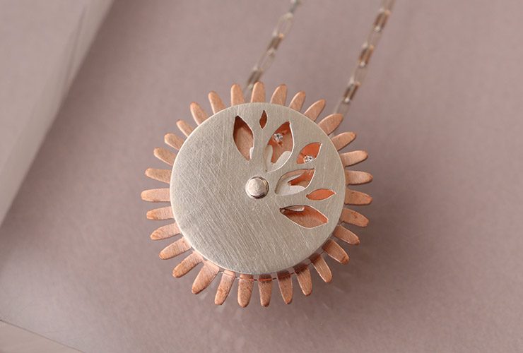 Spinny Diamond Flower Necklace by Laura Eyles
